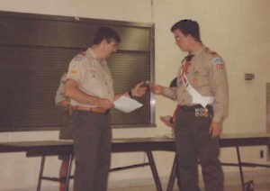 Scoutmaster Roger presenting award to famed Eagle Scout