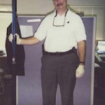 Officer Estes with a 6 foot bong during a search warrant of a house